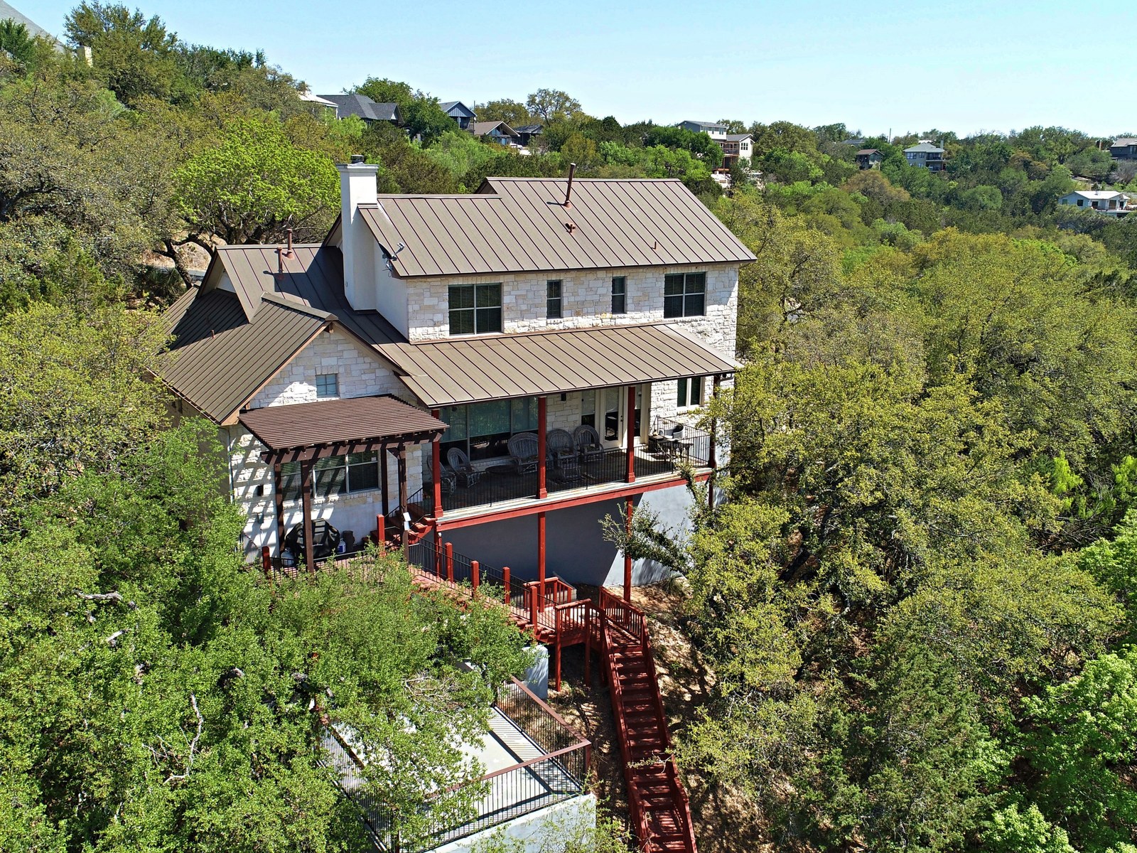 Spicewood vacation home surrounded by Hill Country trees